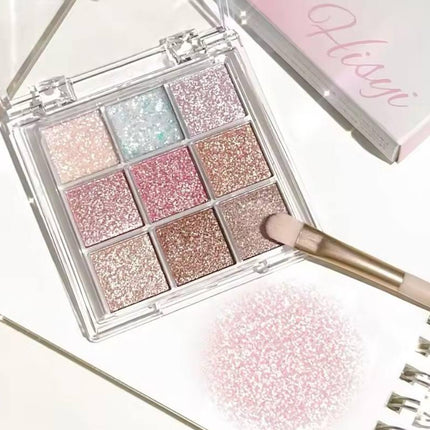 Palette de fards à paupières pailletés rose et doré avec pinceau maquillage